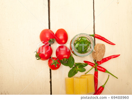 Italian pasta paccheri with tomato mint and chili pepper 69488960