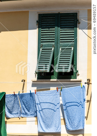Towels Hanging out to dry on a Clothesline in Liguria Italy 69489157