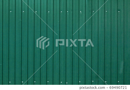 Background of painted corrugated tin iron with galvanized screw heads and vertical orientation 69490721