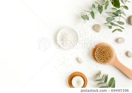 Spa Background. Natural, Organic spa cosmetics products, eco friendly bathroom accessories, eucalyptus leaves. Skincare concept on white background. Spa Background. Natural, Organic spa cosmetics products, eco friendly bathroom accessories, eucalyptus leaves. Skincare concept on white background. 69495396