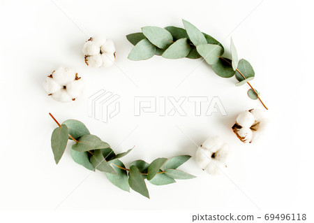 Wreath frame made of branches eucalyptus, leaves and cotton isolated on white background. flat lay, top view Wreath frame made of branches eucalyptus, leaves and cotton isolated on white background. flat lay, top view 69496118