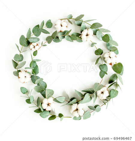 Wreath frame made of branches eucalyptus, leaves and cotton isolated on white background. flat lay, top view Wreath frame made of branches eucalyptus, leaves and cotton isolated on white background. flat lay, top view 69496467