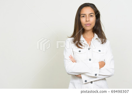 Portrait of beautiful multi ethnic businesswoman with arms crossed Portrait of beautiful multi ethnic businesswoman with arms crossed 69498307