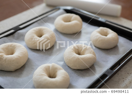 Making bread at home: Plain bagels molded before secondary fermentation 69498411
