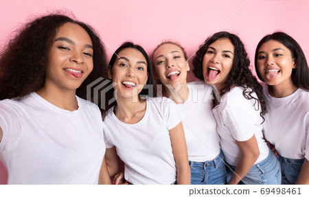 Multicultural Ladies Making Group Selfie Showing Tongues Over Pink Background Multicultural Ladies Making Group Selfie Showing Tongues Over Pink Background 69498461
