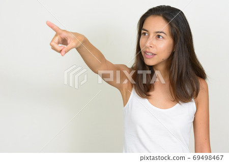 Portrait of beautiful multi ethnic woman pointing finger Portrait of beautiful multi ethnic woman pointing finger 69498467