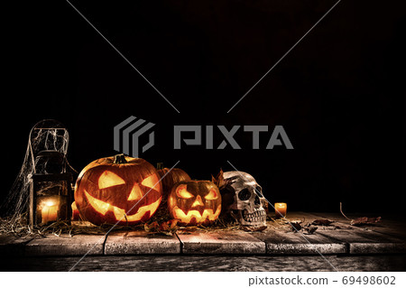 Halloween pumpkins on dark spooky forest. Halloween pumpkins on dark spooky forest. 69498602