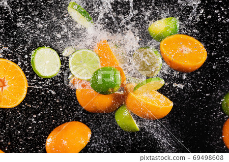 Freeze Motion Shot of Fresh Fruits Collision Freeze Motion Shot of Fresh Fruits Collision 69498608