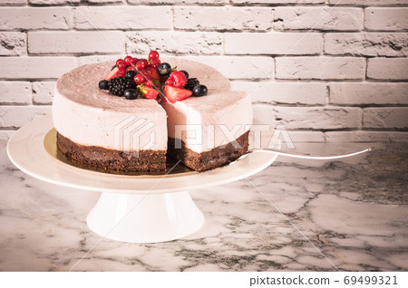 Mousse cake on cake plate Mousse cake on cake plate 69499321