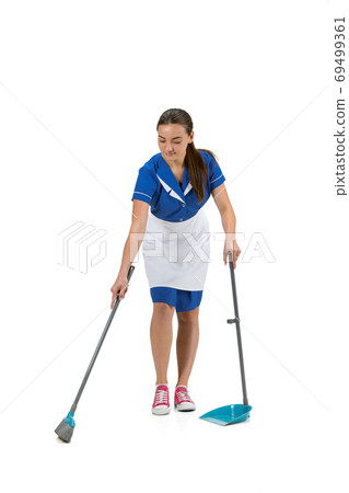 Portrait of female made, cleaning worker in white and blue uniform isolated over white background Portrait of female made, cleaning worker in white and blue uniform isolated over white background 69499361