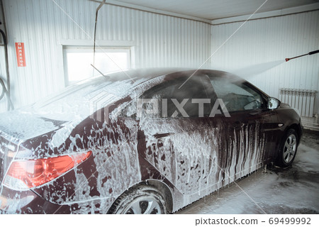 Car wash with soap.Washing car with soap. Close up concept. Car wash with soap.Washing car with soap. Close up concept. 69499992