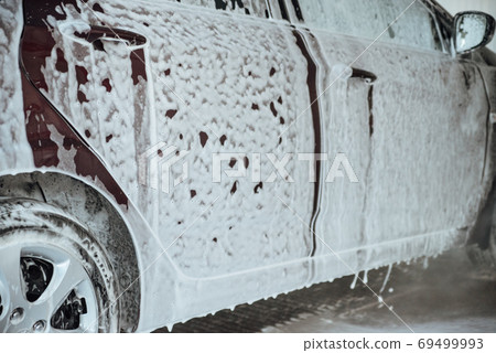 Car wash with soap.Washing car with soap. Close up concept. Car wash with soap.Washing car with soap. Close up concept. 69499993