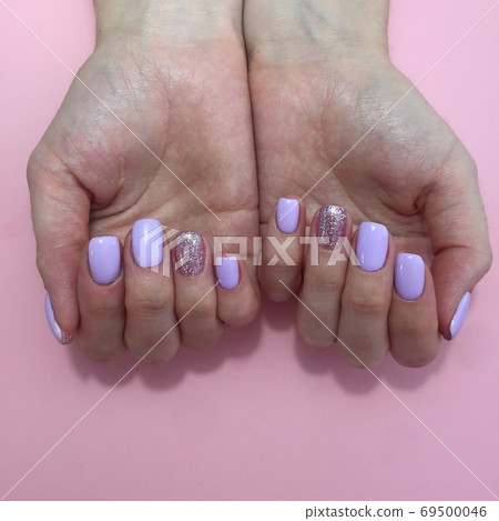 Manicure of different colors on nails. Female Manicure of different colors on nails. Female 69500046
