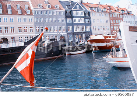 Nyhavn buildings with boats in Copenhagen, Denmark. 69500087