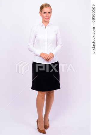 Full body shot of beautiful blonde businesswoman 69500509
