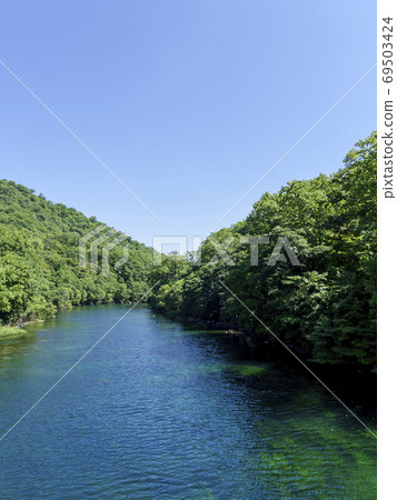 Blue-green Chitose River and clear sky 69503424