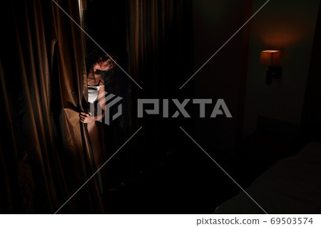 ghost woman in haunted hotel with dark filter, halloween concept 69503574