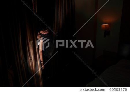 ghost woman in haunted hotel with dark filter, halloween concept 69503576