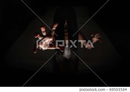 ghost women hand in haunted hotel with dark filter, halloween concept 69503584