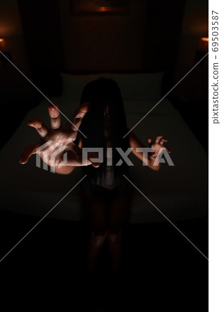 ghost women hand in haunted hotel with dark filter, halloween concept 69503587