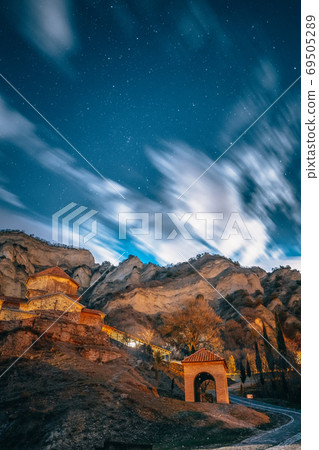 Mtskheta, Georgia. Shio-mgvime Monastery. Medieval Monastic Shio-Mgvime Monastery Shiomgvime Complex In Limestone Canyon Under Autumn Starry Night Sky. Starry Sky Above Famous Place In Limestone Mtskheta, Georgia. Shio-mgvime Monastery. Medieval Monastic Shio-Mgvime Monastery Shiomgvime Complex In Limestone Canyon Under Autumn Starry Night Sky. Starry Sky Above Famous Place In Limestone 69505289