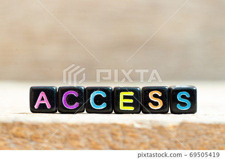 Black bead with color letter in word access on wood background Black bead with color letter in word access on wood background 69505419