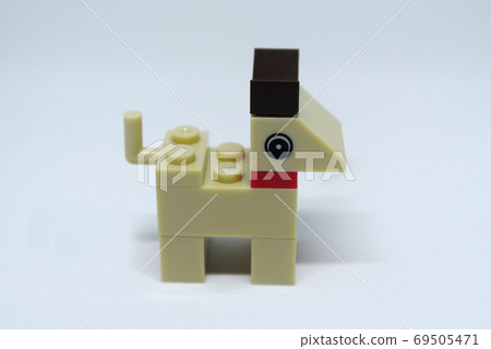 Selected focused on the shape of a dog made of plastic toy blocks and isolated on white background Selected focused on the shape of a dog made of plastic toy blocks and isolated on white background 69505471