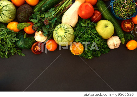 Vegetables dark background with copy space. Healthy meal. Menu, price background Vegetables dark background with copy space. Healthy meal. Menu, price background 69505556