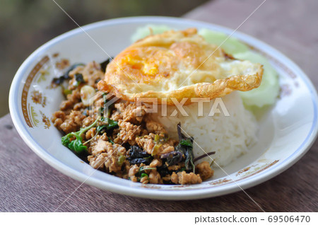 stir fried pork with chili paste, holy basil and fried egg stir fried pork with chili paste, holy basil and fried egg 69506470