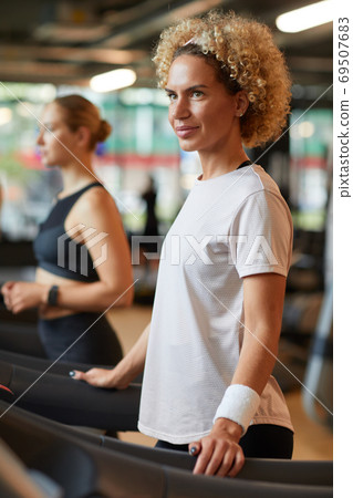 Woman training on treadmill 69507683
