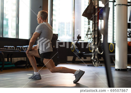 Man training in gym Man training in gym 69507867