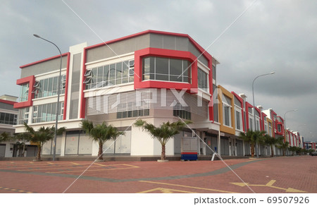 CYBERJAYA, MALAYSIA - SEPTEMBER 29, 2017: Terrace shop lots facade. The architect introduced colourful and attractive facade to attract tenant and customer. CYBERJAYA, MALAYSIA - SEPTEMBER 29, 2017: Terrace shop lots facade. The architect introduced colourful and attractive facade to attract tenant and customer. 69507926