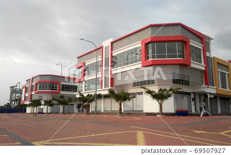 CYBERJAYA, MALAYSIA - SEPTEMBER 29, 2017: Terrace shop lots facade. The architect introduced colourful and attractive facade to attract tenant and customer. CYBERJAYA, MALAYSIA - SEPTEMBER 29, 2017: Terrace shop lots facade. The architect introduced colourful and attractive facade to attract tenant and customer. 69507927