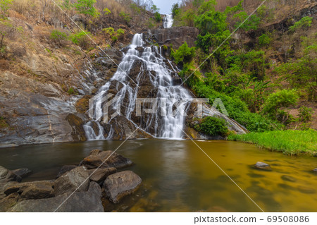 Tao Dam waterfall, the beautiful waterfall in deep forest at Klong Wang Chao national park ,Kamphaeng Phet, Thailand Tao Dam waterfall, the beautiful waterfall in deep forest at Klong Wang Chao national park ,Kamphaeng Phet, Thailand 69508086