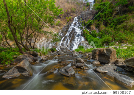 Tao Dam waterfall, the beautiful waterfall in deep forest at Klong Wang Chao national park ,Kamphaeng Phet, Thailand Tao Dam waterfall, the beautiful waterfall in deep forest at Klong Wang Chao national park ,Kamphaeng Phet, Thailand 69508107