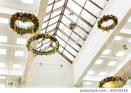 Abstract background of Christmas decor in the mall, airport or station room. Winter holidays. Abstract background of Christmas decor in the mall, airport or station room. Winter holidays. 69508456