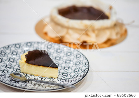 basque burnt cheesecake in dish, spanish dessert 69508666