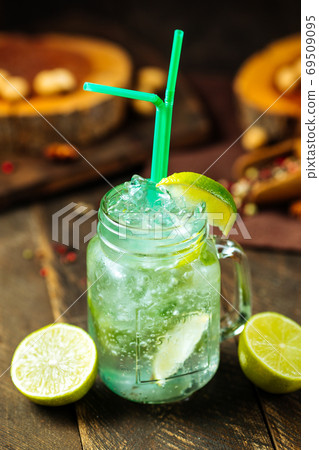 Lime lemonade in a glass mug with brick wall Lime lemonade in a glass mug with brick wall 69509095