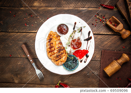 Grilled gourmet chicken fillet steak with rice Grilled gourmet chicken fillet steak with rice 69509096