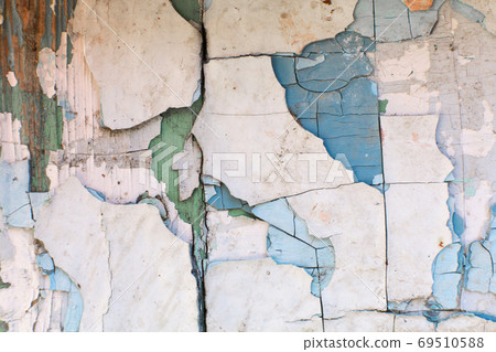 paint peels off the wall. Mill painting with a large number of layers of old paint 69510588