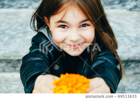 Little happy girl in urban background Little happy girl in urban background 69511633