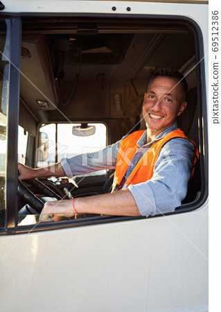 Portrait of delivery driver in the car 69512386