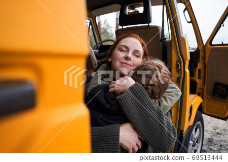 Mother holds daughter to heart 69513444