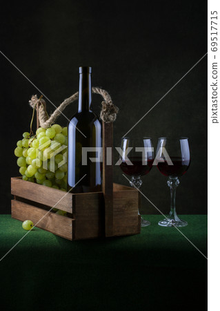 Still life with grapes and wine in glasses 69517715