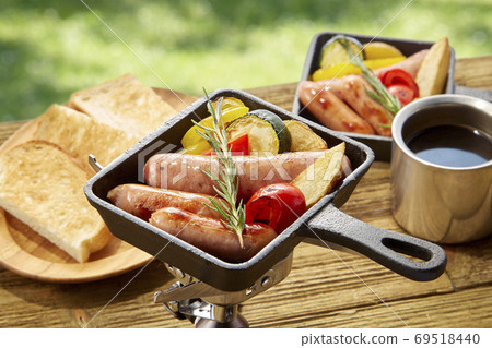 Easy outdoor cooking to enjoy in a skillet pot 69518440