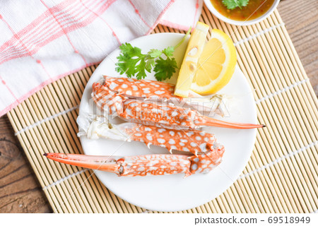 Boiled crab food on white plate and seafood sauce on the table - 69518949