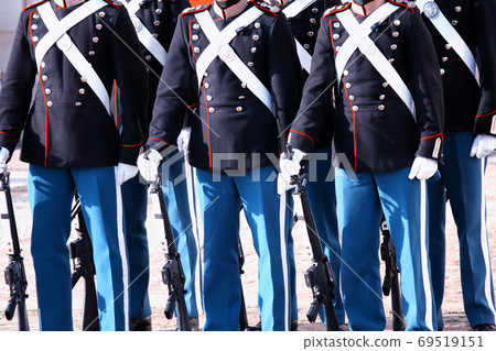 The Royal Guard with army guns in Copenhagen, Denmark marching The Royal Guard with army guns in Copenhagen, Denmark marching 69519151