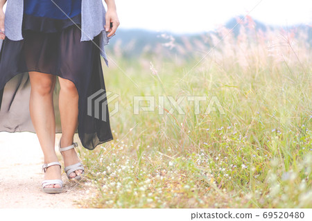 Carefree happy woman enjoying nature on the street 69520480
