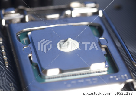 CPU with thermal paste applied. CPU with thermal paste applied. 69521288