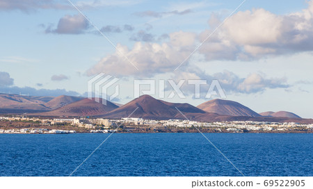 The view towards the resort of Costa Teguise on the Spanish Canary Island of Lanzarote. The view towards the resort of Costa Teguise on the Spanish Canary Island of Lanzarote. 69522905